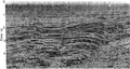 Figure 7.0-10  A cross-section from a 3-D poststack time-migrated volume of 3-D DMO-stacked data.