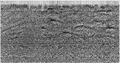 Figure 7.0-3  A 2-D CMP-stacked section (a) before, and (b) after migration.